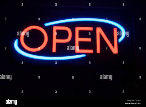 Neon Open Sign Against Black Background Stock Photo Alamy