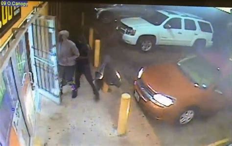 Video Surveillance Shows Robbers Shooting Convenience Store Employee Fleeing Scene