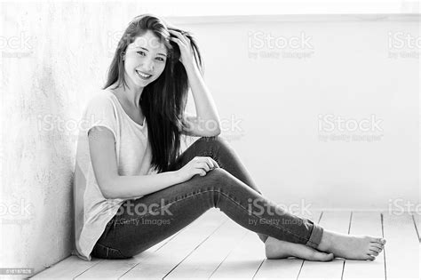 Beautiful Girl Sitting On The Floor Stock Photo Download Image Now