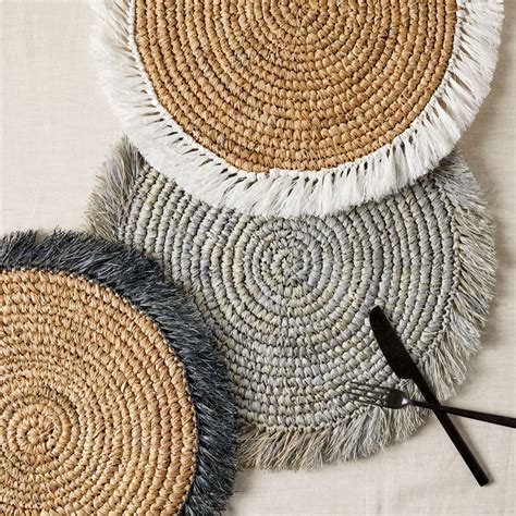 Handwoven of beautiful, naturally sturdy rattan, the tava rectangle placemat is the perfect backdrop for white or colorful dinnerware. Woven Rattan Placemat | west elm United Kingdom