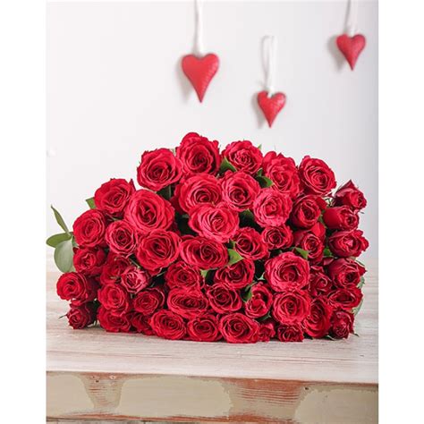 Here are 42 gift ideas she'll love — from sweet keepsakes to experiences to enjoy together. Red Roses in Cellophane for Valentine's Day | inMotion Flowers