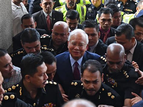 former malaysian pm najib razak charged over 1mdb corruption scandal the australian