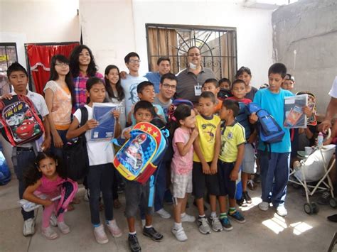 Giving School Supplies To Orphan Children In Juarez Mexico Orphanage