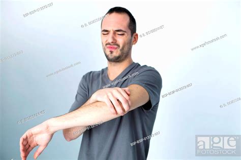 Man With Painful Elbow Stock Photo Picture And Royalty Free Image