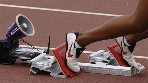 Why are track starting blocks designed to begin from the crouching ...