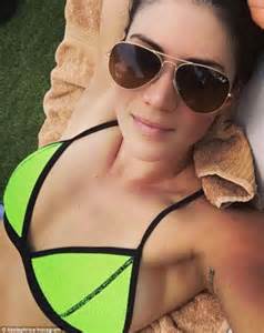 Stephanie Rice Shows Off Her Decolletage In A Bright Bikini Top Daily Mail Online