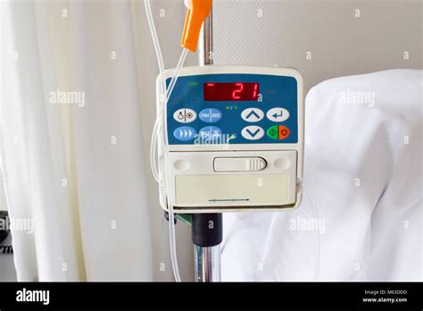 Infusion Pump Feeding Iv Drip In Patient Room In The Hospital On