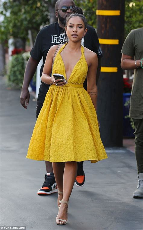 karrueche tran shows off her braless chest in sexy yellow dress in hollywood daily mail online