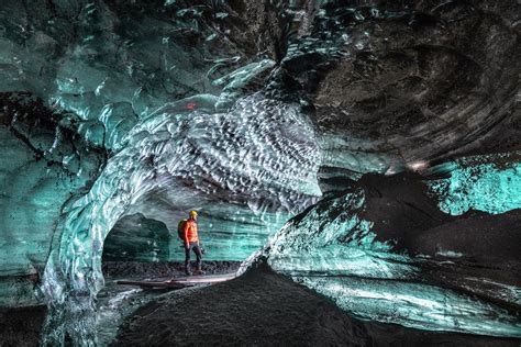 Man Exploring Ice Cave Odinn Reykjavik