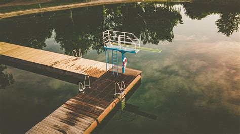 Brown Wooden Dock On Lake During Daytime Photo Free Water Image On