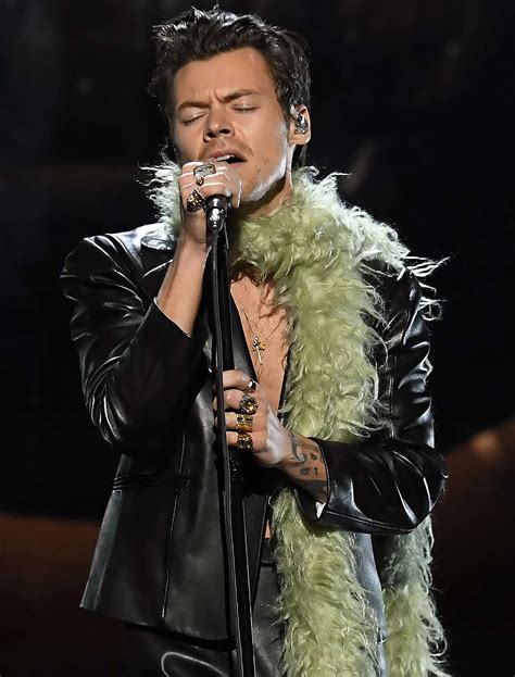 Harry Styles 2021 Grammys Look — A Leather Suit And Feather Boa — Is