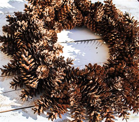 Winter is the perfect time to go foraging for materials as pine cones and acorns start to drop off their branches. Giant Pine Cone Christmas Wreath - Upright and Caffeinated