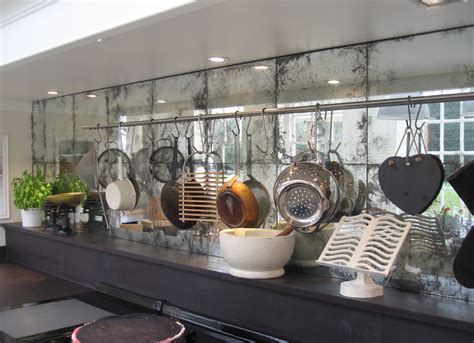 Opt for antique mirrored tiles. Antique Mirror Backplash Touches Modern Feature with Old ...