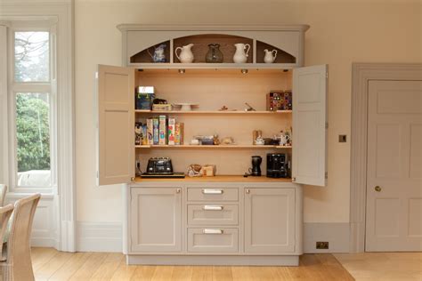 The latitude run assen pantry cabinet is a kitchen organization station that frees up valuable counter and cabinet space, holding your microwave, coffee maker, and other small appliances. Bright freestanding pantry in Kitchen Traditional with ...