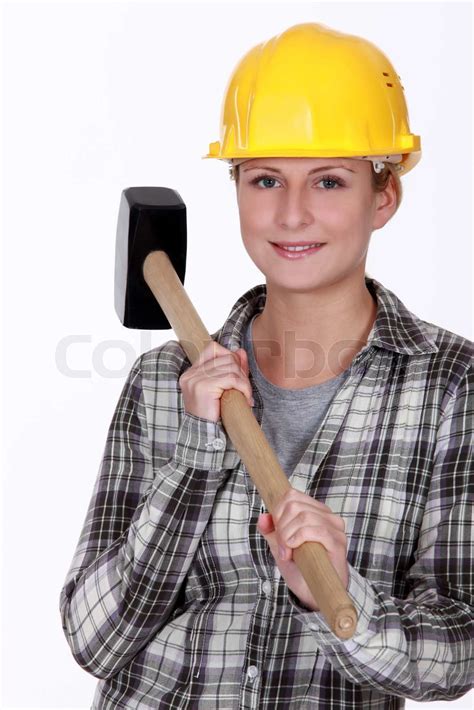 woman holding sledge hammer stock image colourbox