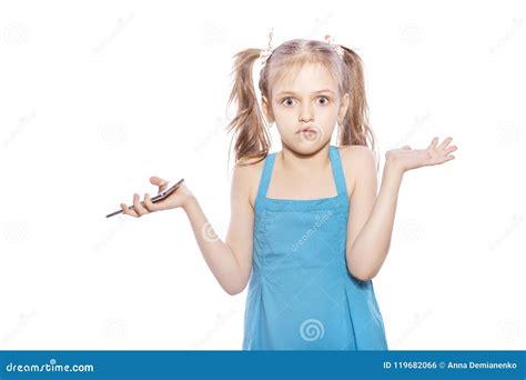 Young Seven Years Old Brunette Girl In Blue Dress On A White Iso Stock