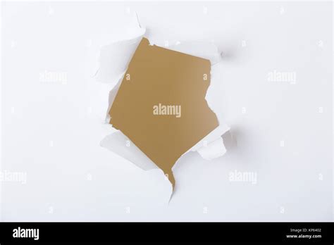 Hole In The Paper With Torn Sides Stock Photo Alamy