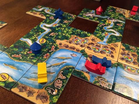Amazonas, players sail their boats to the amazon to discover abundant wildlife. Carcassonne: Amazonas Review | Board Game Quest