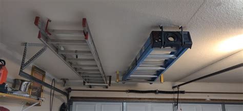 Ladder Storage On Ceiling Above Garage Door