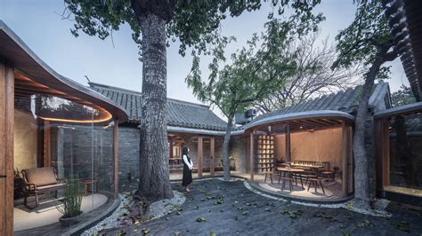 Curving Glass Walls Transform Restored Qishe Courtyard In Beijing