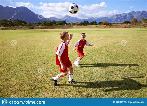 Learning Teamwork While Playing Together Two Boys Playing Soccer On A