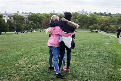 Unrecognizable Female Friends Hugging By Stocksy Contributor Ivan Gener Stocksy