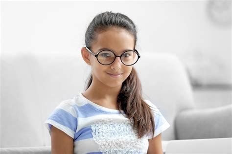 Premium Photo Portrait Of Cute Girl With Glasses At Home