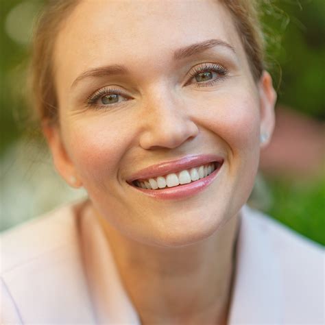 Close-up portrait of a smiling woman on the street. Happy woman's face