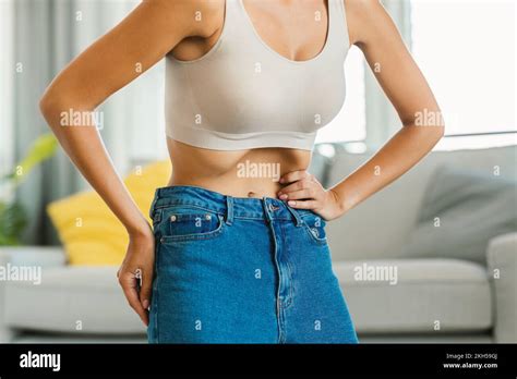 Unrecognizable Young Lady Doing Stomach Vacuum Exercise Flexing