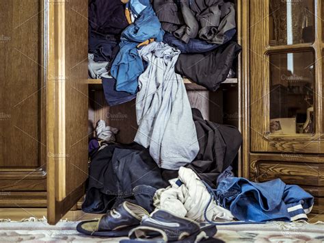 Close Up Of Big Pile Of Messy Clothes Thrown On The Floor Near The Wardrobe High Quality