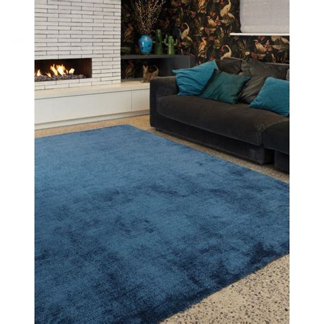 Even animal hides and leather can be used in area rug design; Lapaz Dark Teal Blue Shaggy Rug | Plush area rugs, Teal ...