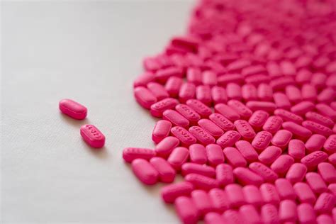 Pink Medication Pill On White Surface · Free Stock Photo