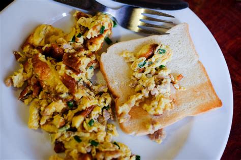 Scrambled Eggs And Slices On Bread Stock Photo Image Of Buttered