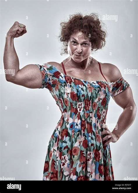 Mature Woman Flexing Muscles Isolated Hi Res Stock Photography And