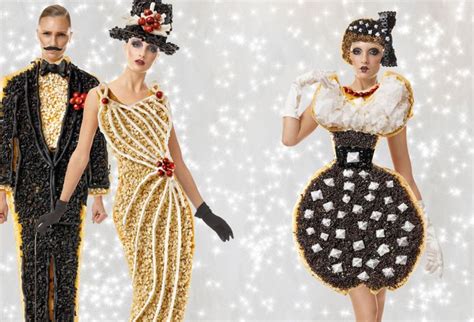 Three Models In Black And White Dresses With Hats On Their Heads One