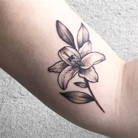 Stargazer Lily On An Arm Styleoholic Arm Tattoos Lily Arm Tattoos