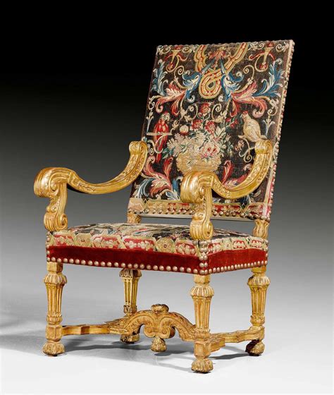 An Ornately Decorated Chair In Gold And Red