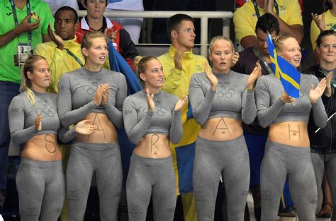 Colorful fans at Rio Supporters of Swedish swimmer Sarah Sjöström have her name written on