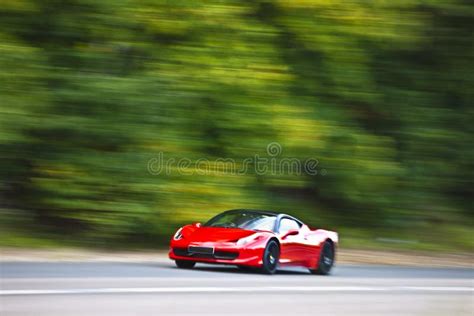 Red Car Driving Fast On Country Road Stock Photo Image Of Road Land