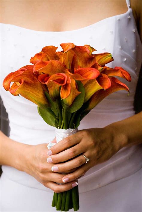 Flower bouquets are often given for special occasions such as birthdays, anniversaries or funerals. orange lily blue delphinium white roses | Mango Calla ...