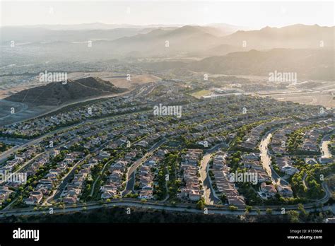 Late Afternoon Aerial View Towards New Suburban Homes And Streets In