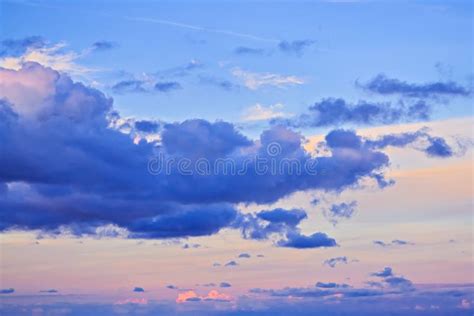Dramatic Sunset Sky With Bright Multi Colored Cumulus Clouds Stock