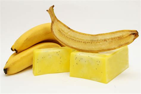 Two Bananas And One Piece Of Soap On A White Background