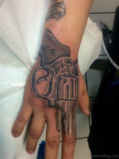 Ak47 tattoo revolver tattoo time tattoos new tattoos cool tattoos tatoos small tattoos desenho tattoo boku no. 28 Funky Gun Tattoos On Hand