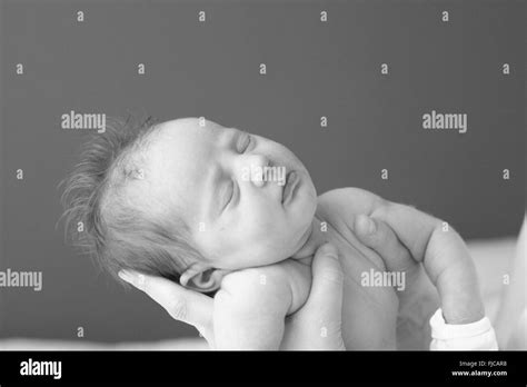 Newborn Baby Girl Asleep In Mums Hands Stock Photo Alamy