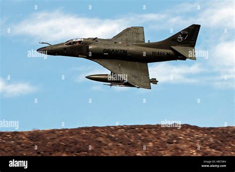 A Draken Operated Douglas A 4k Skyhawk Flies Low Level Through The