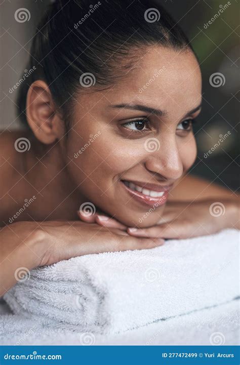I Feel Completely At Ease Here A Young Woman Lying On A Massage Bed At A Spa Stock Image
