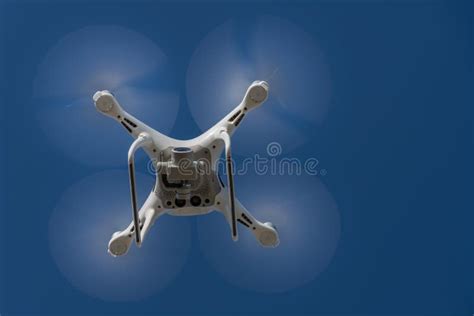 Drone Quad Copter With High Resolution Digital Camera On The Sky Stock
