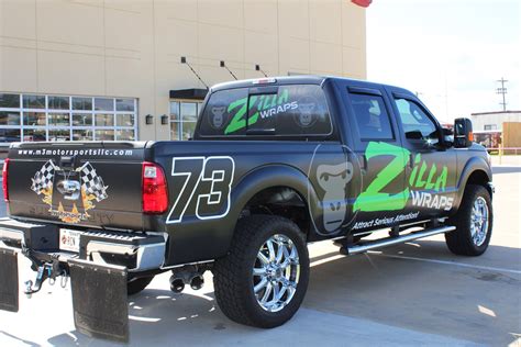 Trying to wrap it white to match the truck. Matte Black Advertising Wraps - Zilla Wraps