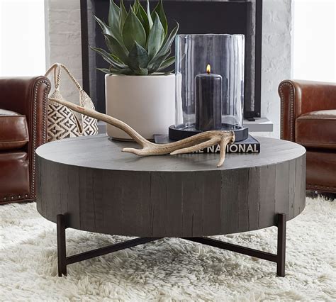 The top of the coffee table is built of salvaged wood from reclaimed shipping pallets milled into individual tongue. Fargo 40" Round Reclaimed Wood Coffee Table | Pottery Barn ...